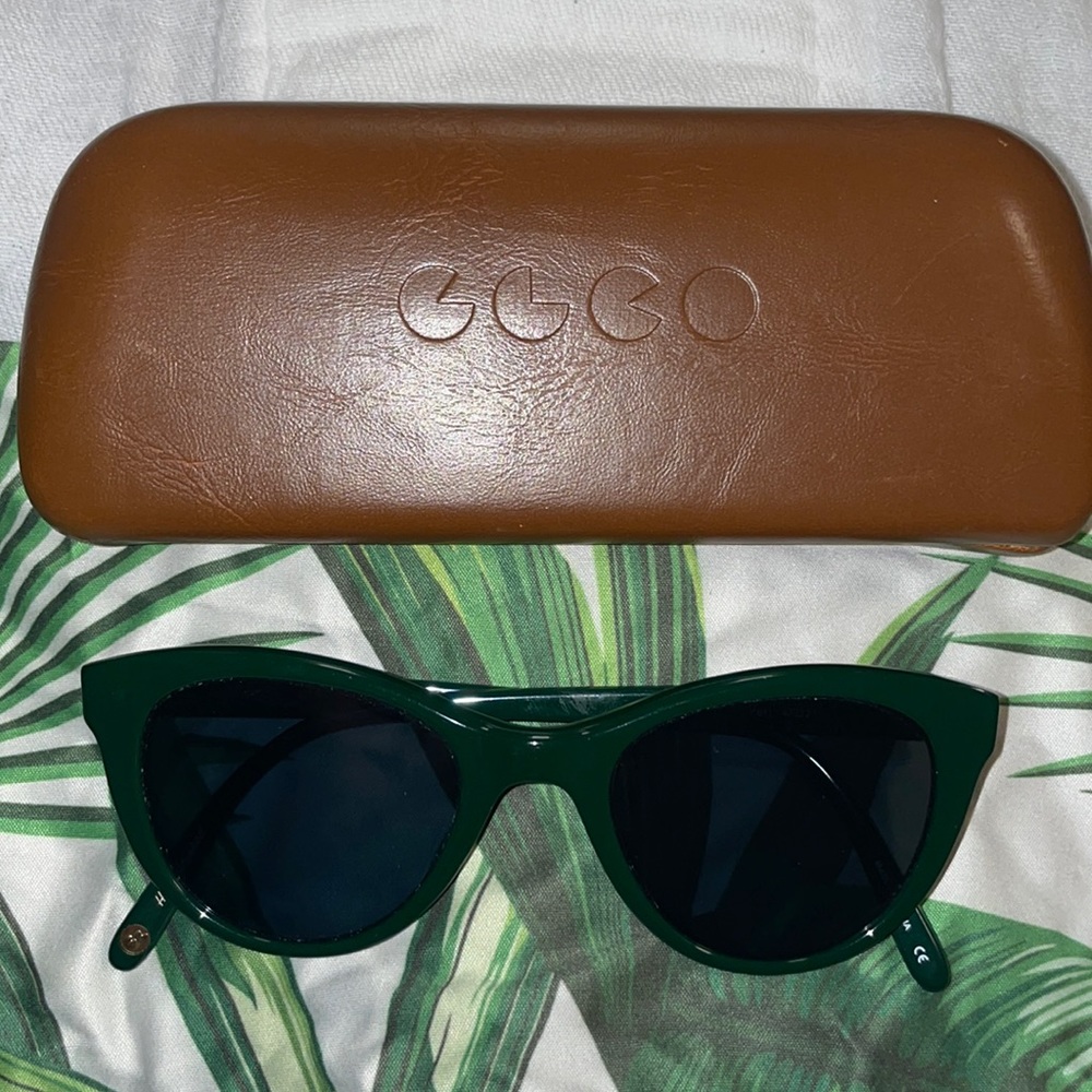 Garrett Leight Sunglasses in the color green.